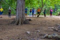 Komodo Dragon, the largest lizard in the world walks on ground. It is a dangerous prehistoric animal. Some tourists around and the