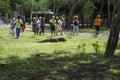 Komodo Dragon, the largest lizard in the world walks on ground. It is a dangerous prehistoric animal. Some tourists around and the