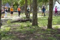 Komodo Dragon, the largest lizard in the world walks on ground. It is a dangerous prehistoric animal. Some tourists around and the