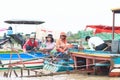 KOMPONG PHLUK, CAMBODIA - OCTOBER 24: Unidentified local people, await tourists on boats to take them to the floating village of Royalty Free Stock Photo