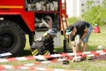 Girl in a suit of a fireman preparing to overcome the obstacle c