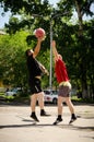 Young men play amateur basketball in summer. Low point shooting