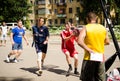 Young men play amateur basketball in summer