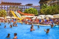 Konakli, Turkey - August 18, 2017: Swimming pool with water park in resort tropical hotel. Happy people swim and relax in pool Royalty Free Stock Photo