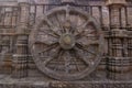 A chariot wheel carved into the wall of the 13th century Konark Sun or Surya Temple, Odisha, India