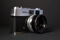 Konica vintage rangefinder camera auto s 1.6 35mm on a black background. Royalty Free Stock Photo