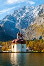 Konigssee lake Konigsee in foggy weather, St. Bartholoma church the background Watzmann mountains , near the German Austrian Royalty Free Stock Photo