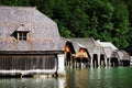 Wooden boat houses on the shore of Konigssee Lake.