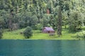 Konigssee near Berchtesgaden surrounded with forest and small shed, Germany