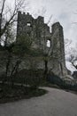 Walking path leading to castle ruins on cloudy day Royalty Free Stock Photo