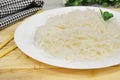 Konjac or Shirataki noodles with Chinese chopsticks. Japanese traditional dish. Healthy food for weight loss, keto diet Royalty Free Stock Photo