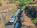 Train coming out of a tunnel in Konkan region of Maharashtra, India.