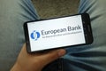 Man holding smartphone with European Bank for Reconstruction and Development EBRD logo Royalty Free Stock Photo