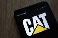 Caterpillar logo displayed on a modern smartphone