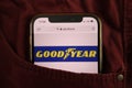 KONSKIE, POLAND - August 17, 2021: Goodyear Tire and Rubber Company logo on mobile phone hidden in jeans pocket Royalty Free Stock Photo