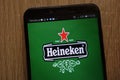 Heineken logo displayed on a modern smartphone