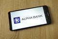 Alpha Bank logo displayed on smartphone