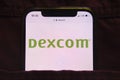 KONSKIE, POLAND - February 27, 2022: DexCom Inc logo on mobile phone hidden in jeans pocket