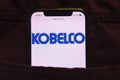 KONSKIE, POLAND - February 27, 2022: Kobe Steel Ltd logo on mobile phone hidden in jeans pocket Royalty Free Stock Photo