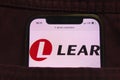 KONSKIE, POLAND - February 18, 2022: Lear company logo on mobile phone hidden in jeans pocket