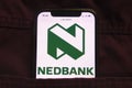 KONSKIE, POLAND - February 18, 2022: Nedbank Group logo on mobile phone hidden in jeans pocket