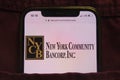 KONSKIE, POLAND - February 22, 2022: New York Community Bancorp Inc logo on mobile phone hidden in jeans pocket Royalty Free Stock Photo