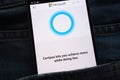 Cortana website displayed on smartphone hidden in jeans pocket