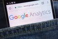 Google Analytics website displayed on smartphone hidden in jeans pocket Royalty Free Stock Photo