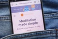 Headspace website displayed on smartphone hidden in jeans pocket