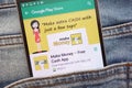 Make Money - Free Cash App on Google Play Store website displayed on smartphone hidden in jeans pocket