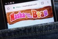 Masha and The Bear website displayed on smartphone hidden in jeans pocket