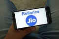 KONSKIE, POLAND - June 29, 2019: Reliance Jio Infocomm Limited Indian mobile network operator logo on mobile phone