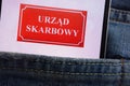 Urzad Skarbowy Polish Tax Office logo displayed on smartphone hidden in jeans pocket