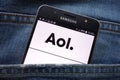 AOL website displayed on smartphone hidden in jeans pocket