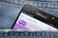Benq website displayed on Samsung smartphone hidden in jeans pocket