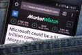 MarketWatch website displayed on smartphone hidden in jeans pocket