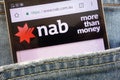 NAB National Australia Bank website displayed on smartphone hidden in jeans pocket