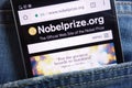 Nobel Prize website displayed on smartphone hidden in jeans pocket