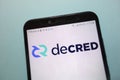 Decred DCR cryptocurrency logo displayed on smartphone