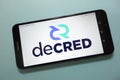 Decred DCR cryptocurrency logo displayed on smartphone