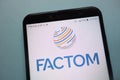 Factom FCT cryptocurrency logo displayed on smartphone