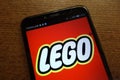 Lego logo displayed on a modern smartphone