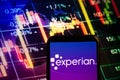 KONSKIE, POLAND - September 10, 2022: Smartphone displaying logo of Experian company on stock exchange chart background