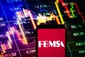 KONSKIE, POLAND - September 10, 2022: Smartphone displaying logo of Fomento Economico Mexicano FEMSA company on stock exchange Royalty Free Stock Photo