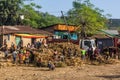 KONSO, ETHIOPIA - FEBRUARY 7, 2020: People on a pile of harvested corn in Konso, Ethiop