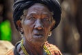 Close up portrait of Authentic African Konso Old Woman with Black Turban and necklace in the Local Tribal Village Royalty Free Stock Photo