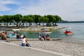 Konstanz, Germany - Harbor at Lake Constance with people relaxing on sunny summer day Royalty Free Stock Photo