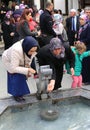 Unidentified Muslim Women washing their hands at fountain of Mevlana Museum Mosque