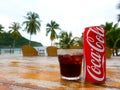 Kood island,Thailand ,8 June 2017 : Cocacola can and in glass Drink for the hot weather and the beach background