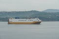 Big White and yellow Ro-Ro vessel or car carrier from shipping company Grimaldi Lines.